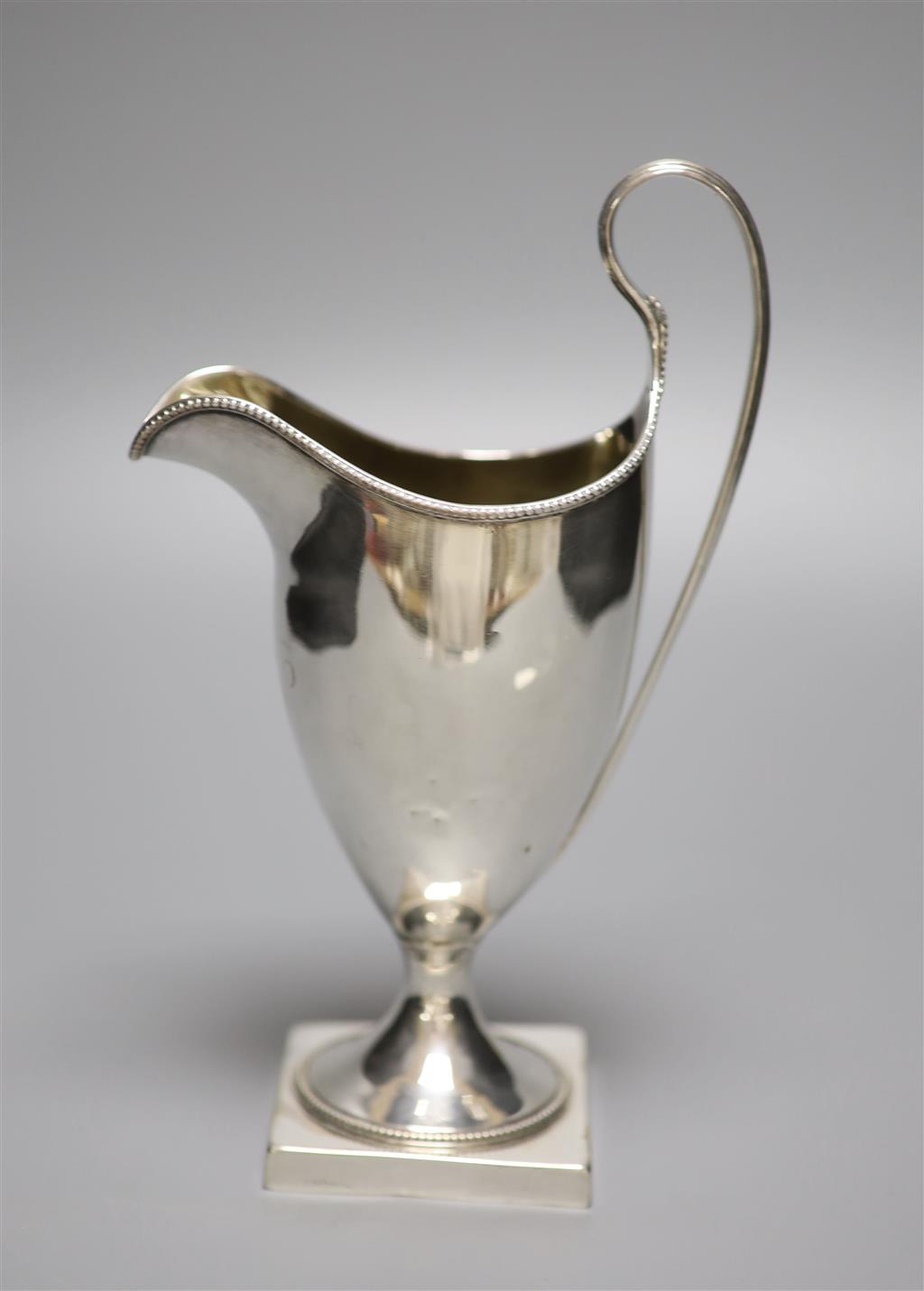 A George III silver helmet cream jug, indistinct makers mark, London, 1791, 20cm, 5.5oz.